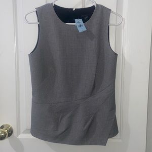 Ann Taylor Petites black and white, sleeveless top in size 4p.